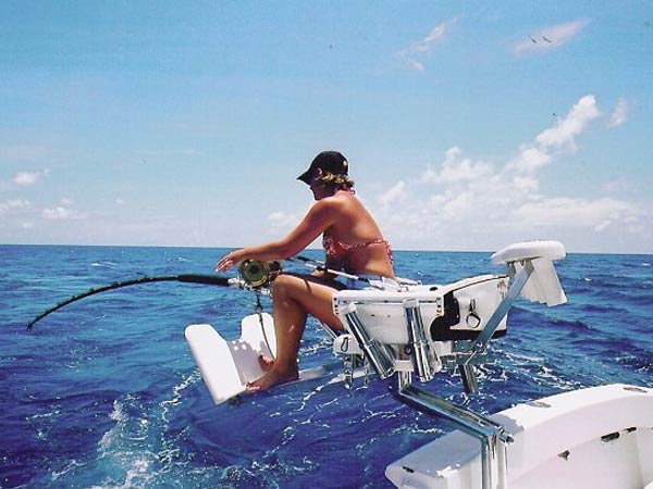 Angler fighting a catch from the chair aboard Mark The Shark