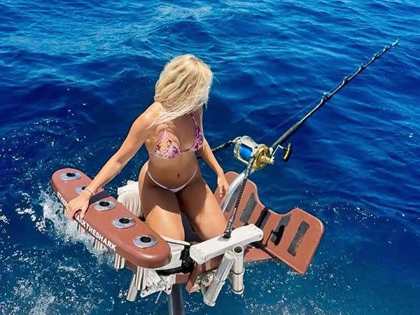 Angler fighting a catch from the chair aboard Mark The Shark