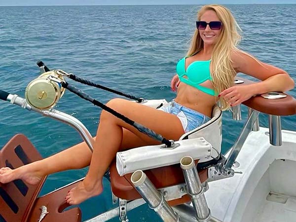 Angler fighting a catch from the chair aboard Mark The Shark