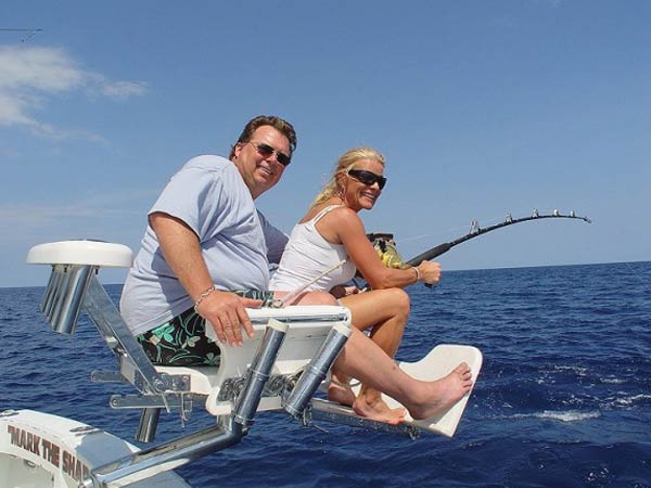 Angler fighting a catch from the chair aboard Mark The Shark