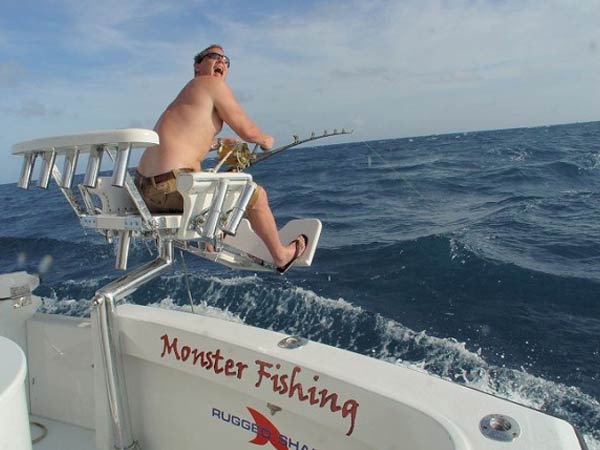 Angler fighting a catch from the chair aboard Mark The Shark